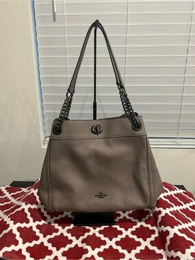 Coach Pebbled Leather Edie Turn Lock Shoulder Bag in Grayish Taupe.